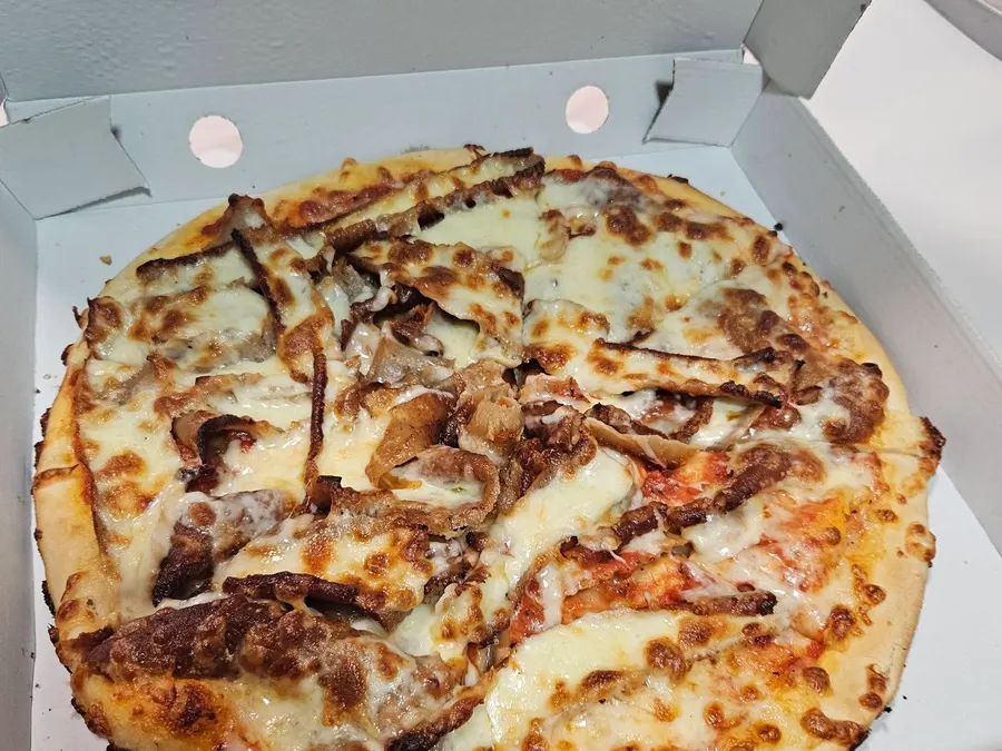Donner meat pizza in its box