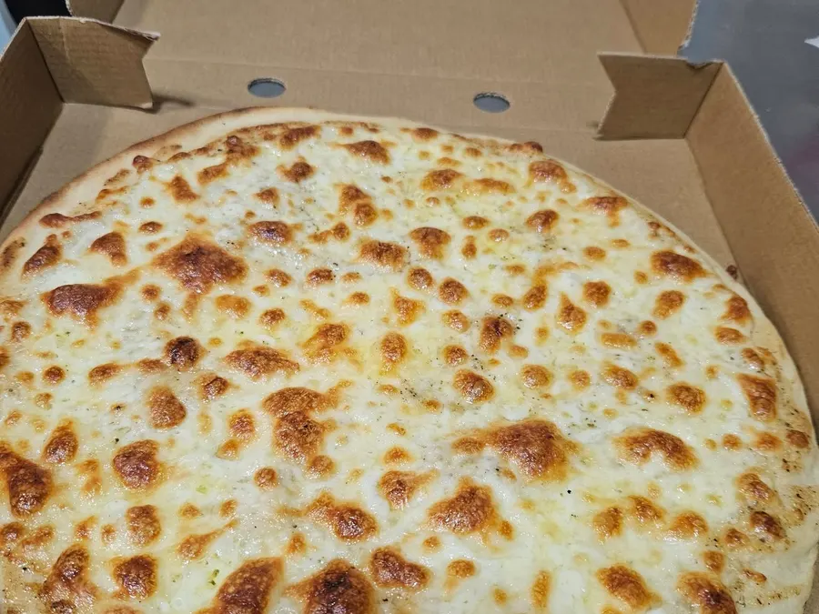 Garlic pizza bread with cheese in its box